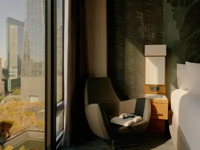 a hotel room with a chair and a window at The Cloud One New York-Downtown, by the Motel One Group in New York