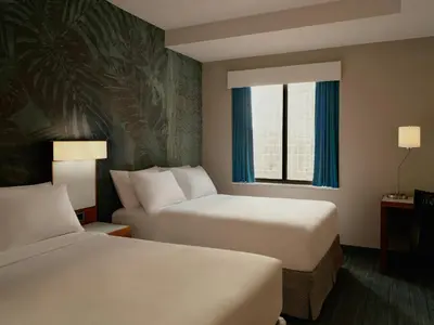 a hotel room with two beds and a window at The Cloud One New York-Downtown, by the Motel One Group in New York
