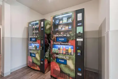 a vending machine with snacks and drinks on the wall at WoodSpring Suites Philadelphia Northeast in Philadelphia