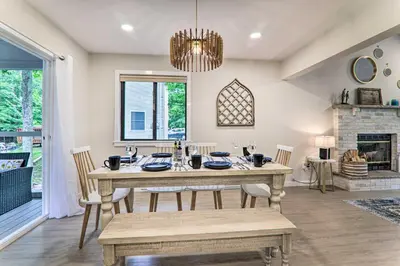 a dining room with a table and chairs and a fireplace at Relax Fireside! Retreat 15 Mi to Camelback Slopes in Tobyhanna
