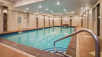 a large swimming pool in a hotel room at Best Western Plus Concordville Hotel in Concordville
