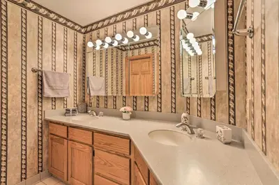 a bathroom with a sink and a mirror at Riverside Retreat in Catskill Mountains with Pool, Hot Tub & Game Room in Starlight