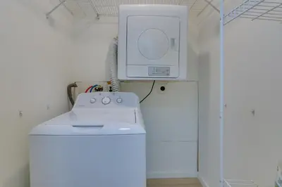 a kitchen with a white stove and a microwave at Cozy Swan Lake Apt with Grill and Private Yard in Swan Lake