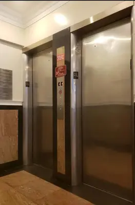 a elevator in a building with a sign on it at Hansem stay near Empire State Building in New York