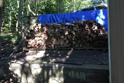 a pile of wood on top of a wall at Large family house on the lake in Hewitt