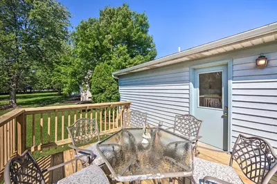 a deck with two chairs and a table at 12 Mi to Hersheypark Family Home with Deck! in Harrisburg