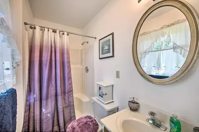 a bathroom with a sink and a mirror at 12 Mi to Hersheypark Family Home with Deck! in Harrisburg