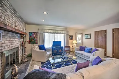 a living room with a couch and a fireplace at 12 Mi to Hersheypark Family Home with Deck! in Harrisburg