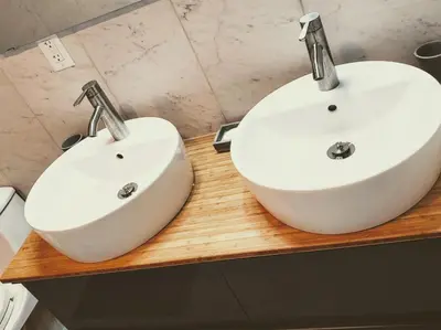 two white sinks on a wooden counter in a bathroom at Sheshequin in Thornhurst