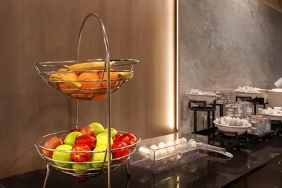 a bowl of fruit on a counter in a room at Best Western Plus Meadowlands in Secaucus