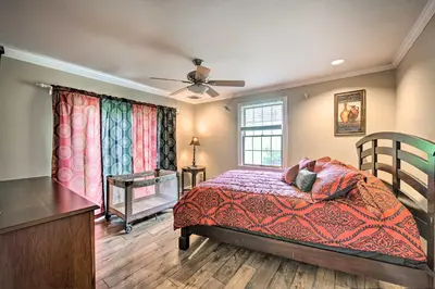 a bedroom with a bed and a dresser and a window at Family-Friendly Coatesville House with Fire Pit in Coatesville