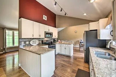 a kitchen with white cabinets and a counter top at Family-Friendly Coatesville House with Fire Pit in Coatesville