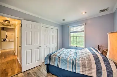 a bedroom with a bed and a window at Family-Friendly Coatesville House with Fire Pit in Coatesville