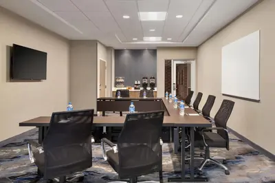 a conference room with a long table and chairs at Fairfield by Marriott Inn & Suites Rockaway in Rockaway