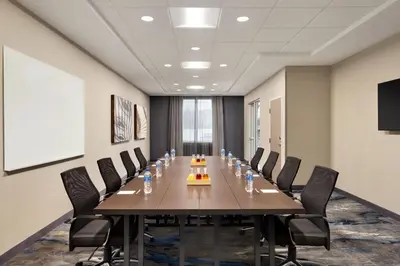 a conference room with a long table and chairs at Fairfield by Marriott Inn & Suites Rockaway in Rockaway