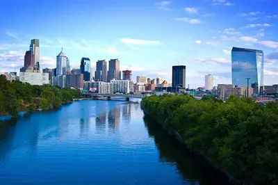 a view of a river with a city in the background at King,Parking,AC,Deck,Train,Uni,Hospital in Bryn Mawr