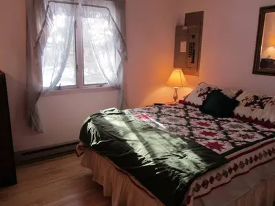 a bedroom with a bed and a window at Cozy Pocono Cottage near Jack Frost Jim Thorpe in Albrightsville