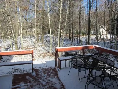 two benches and a table in the snow at Cozy Pocono Cottage near Jack Frost Jim Thorpe in Albrightsville