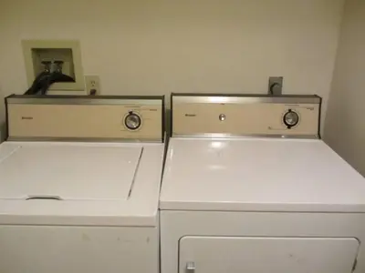 two old refrigerators are sitting in a room at Cozy Pocono Cottage near Jack Frost Jim Thorpe in Albrightsville