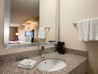 a bathroom with a sink in a hotel room at Super 8 by Wyndham Rahway/Newark in Rahway
