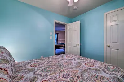 a bedroom with blue walls and a bed and a ceiling at Hot Tub and Yard Stroudsburg Home in Poconos in Stroudsburg
