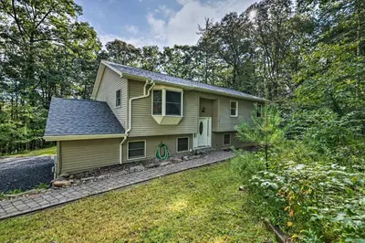 a small yellow house with a yard at Hot Tub and Yard Stroudsburg Home in Poconos in Stroudsburg