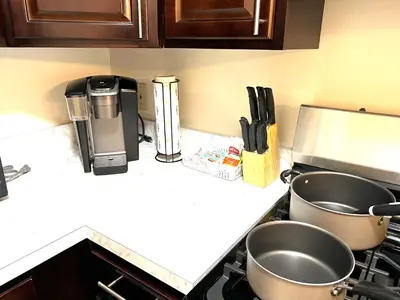 a kitchen counter with two pots on a stove at FREE Parking Minutes from Center City in Hilltop