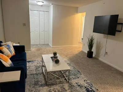 a living room with a couch and a coffee table at FREE Parking Minutes from Center City in Hilltop