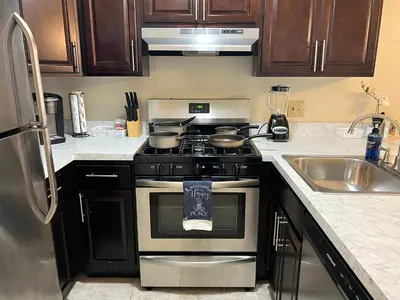 a kitchen with a stove and a sink at FREE Parking Minutes from Center City in Hilltop