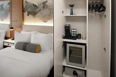 a hotel room with a bed and a tv at Hotel Indigo NYC Downtown - Wall Street by IHG in New York