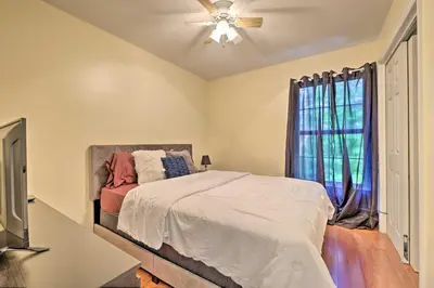 a bedroom with a bed and a ceiling fan at Deck and Backyard Tobyhanna Family Home in Tobyhanna