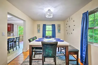 a dining room with a table and chairs at Deck and Backyard Tobyhanna Family Home in Tobyhanna
