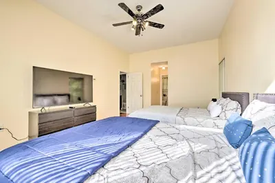 a bedroom with two beds and a ceiling fan at Deck and Backyard Tobyhanna Family Home in Tobyhanna