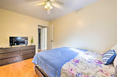 a bedroom with a bed and a flat screen tv at Deck and Backyard Tobyhanna Family Home in Tobyhanna