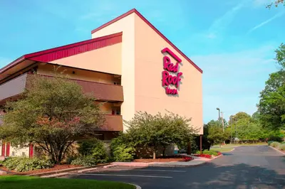 a building with a sign on the side of it at Red Roof Inn Philadelphia - Oxford Valley in Langhorne