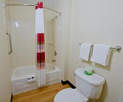a bathroom with a white toilet and a shower at Red Roof Inn Philadelphia - Oxford Valley in Langhorne