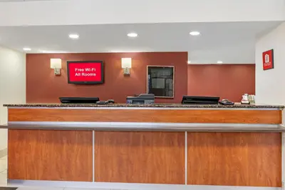 a waiting room with a sign on the wall at Red Roof Inn Parsippany in Parsippany