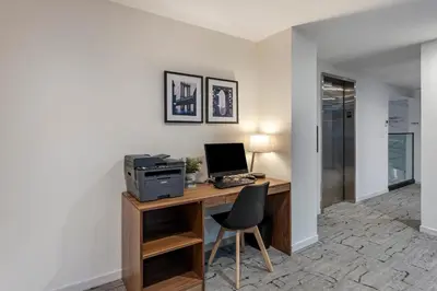 an office with a desk with a computer and a chair at Best Western Plus Soho Hotel in New York