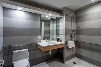 a bathroom with a sink and a toilet and a shower at Best Western Plus Soho Hotel in New York