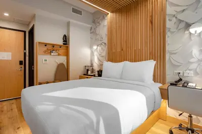 a bedroom with a large white bed and a desk at Best Western Plus Soho Hotel in New York
