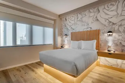 a bedroom with a large bed and a window at Best Western Plus Soho Hotel in New York
