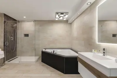 a bathroom with a tub and a sink and a shower at Super 8 by Wyndham Meadowlands in Carlstadt
