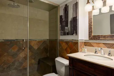 a bathroom with a sink and a shower at Super 8 by Wyndham Meadowlands in Carlstadt