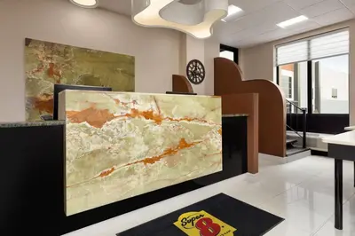 a large painting on display in a room at Super 8 by Wyndham Meadowlands in Carlstadt
