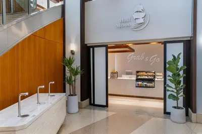 a store with a counter with plants in it at The Westin Jersey City Newport in Jersey City