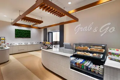 a fast food restaurant with a sign that reads grab and go at The Westin Jersey City Newport in Jersey City