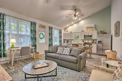 a living room with a couch and a table at Hike and Ski! Blue Heron Brodheadsville Cottage in Brodheadsville