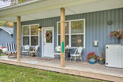 a porch with chairs and a table on a house at Hike and Ski! Blue Heron Brodheadsville Cottage in Brodheadsville