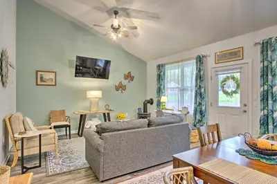 a living room with a couch and a table at Hike and Ski! Blue Heron Brodheadsville Cottage in Brodheadsville