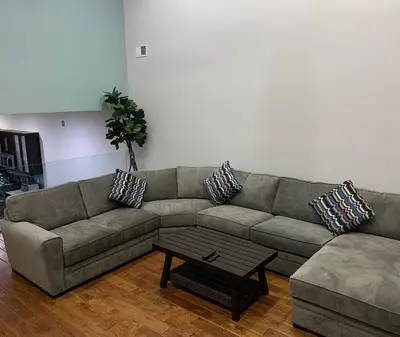a living room with a couch and a coffee table at Center City Roofdeck Hot Tub w Garage in Philadelphia